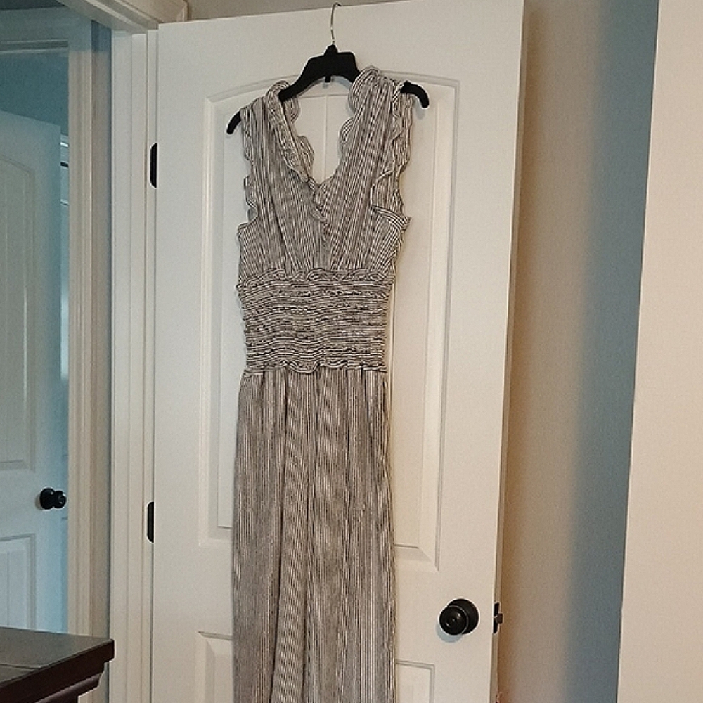 Elegant Striped Sleeveless Jumper with pockets and a rushed/elastic waist band.